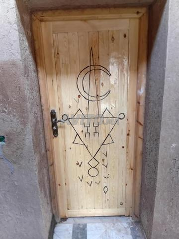 Menuisier Ouarzazate 13 ans d'expérience portes bois traditionnelles pose