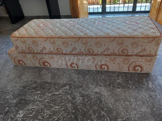 2 banquettes à ressort Dolidol