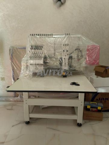 ماكينة تطريز احترافية بالكمبيوتر (12 إبرة وخيط) - 2
