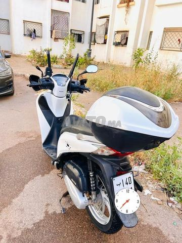 Moto برشيد - 2
