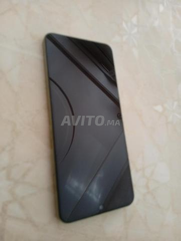 Téléphone Redmi 14C quasi neuf avec chargeur d'origine - 2