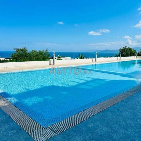 Appartement avec vue sur la piscine et la plage