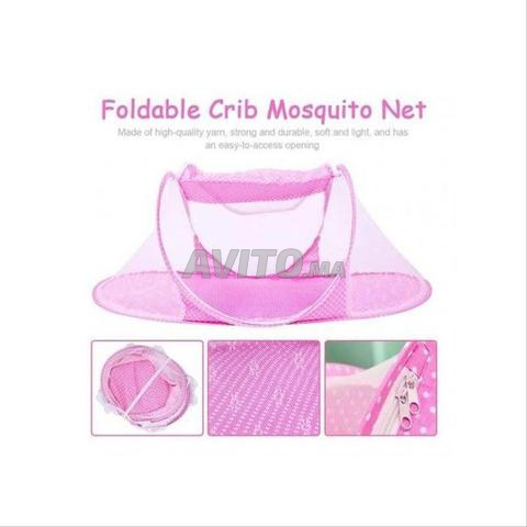 Moustiquaire pliable pour lit de bébé en bon état