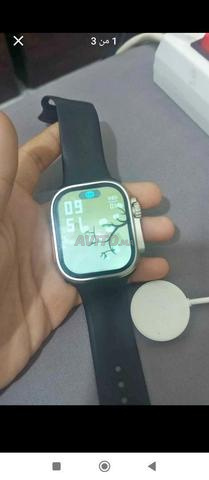 Montre connectée d'occasion avec son chargeur - 2