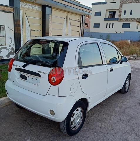 Chevrolet Spark 2ème main 2011 avec la clim - 2