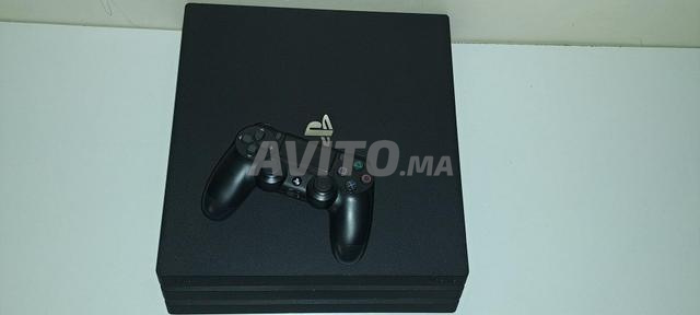 PS4 Pro 1T 2 manettes et CD GTA 5 et FIFA 25 - 2