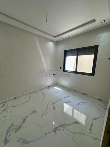 Appt 87m2 -11m2 de garage sous sol à Bouskoura