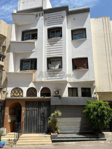 Maison R+2 avec local commercial - 2