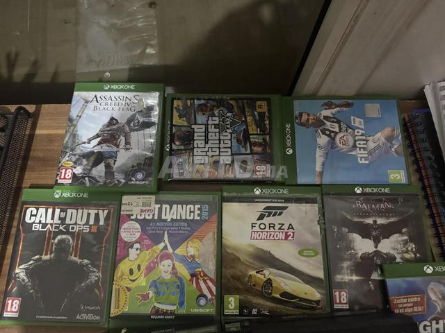 Xbox One avec manette et 10 jeux. - 2