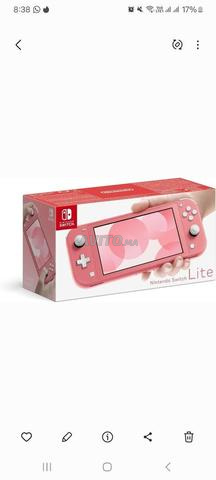 🎮 نينتندو سويتش لايت مع لعبتين - 2