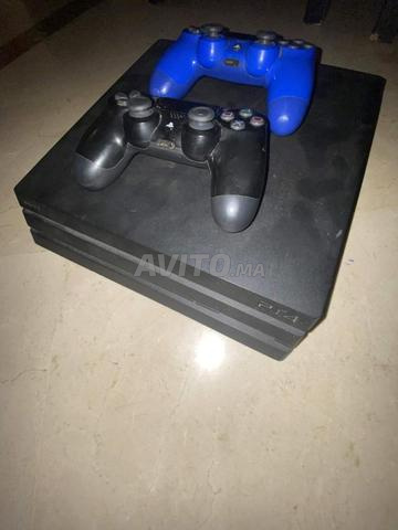PS4 PRO PRATIQUEMENT NEUVE AVEC FC 26 ET MANETTES - 2