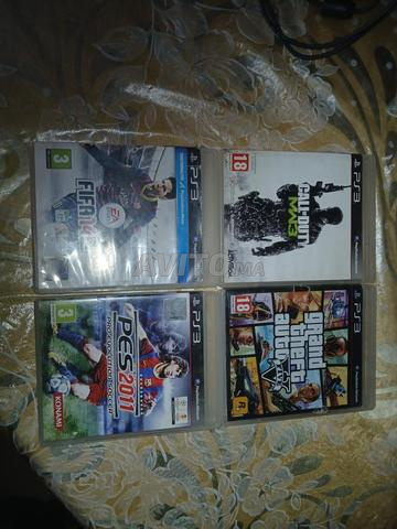 PS3 Slim avec 3 manettes et 9 jeux CD - 2