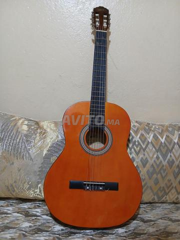 Guitare, Capodastre, Housse de guitare et Flûte - 2