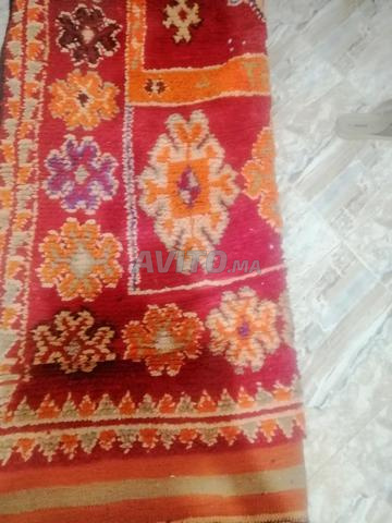 Tapis traditionnel, ses fils principaux en poils de chèvre