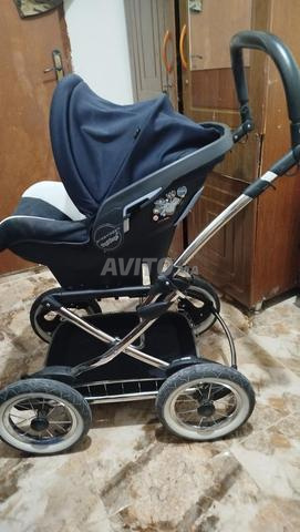 عربة أطفال مع سرير متنقل
