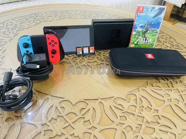 Nintendo Switch V1 avec 3 jeux et sacoche