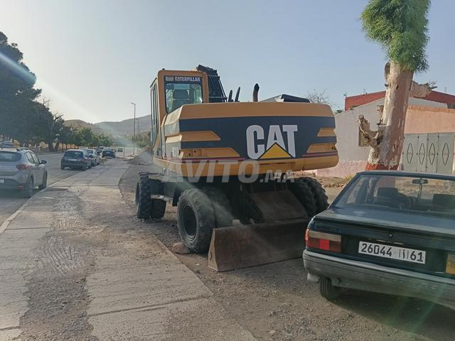 كاتربلر M318 موديل 2000 ديوانة جديدة - 2