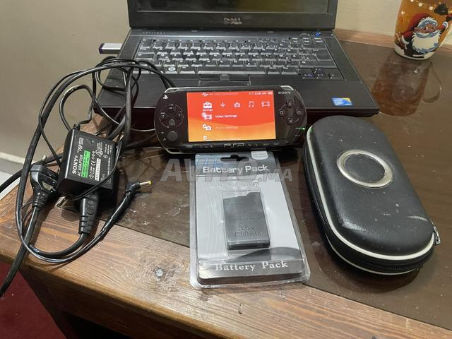 PSP 1000 (Fat) أسود مع شاحن وحافظة