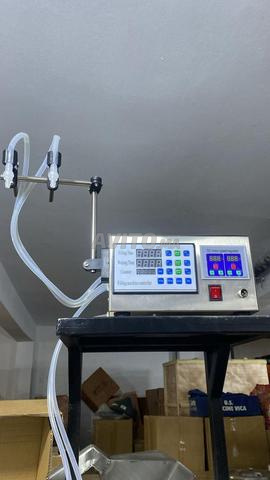 آلات تعبئة للسوائل عسل ، عطور، شامبو... - 2