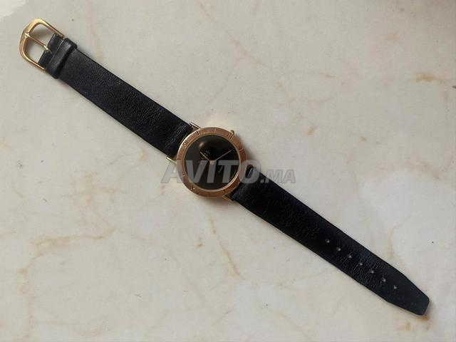 Montre vintage dorée très classe