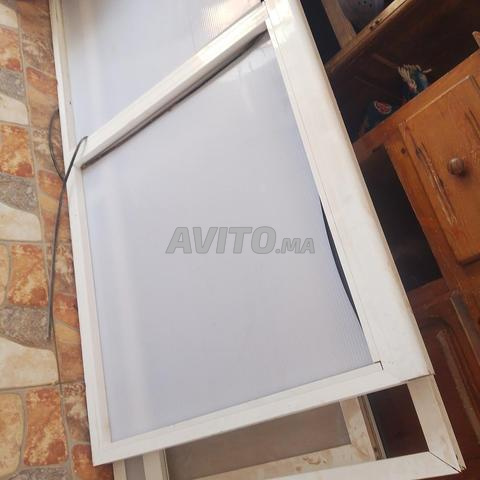 Porte en aluminium bon état