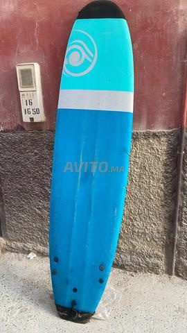 Longboard soft avec une éraflure sur le côté et prix négociable