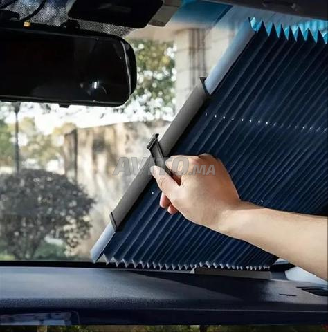 Pare-soleil rétractable pour vitre arrière de voiture