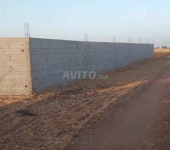 Terrain agricole Tither avec habitation en cours de construction