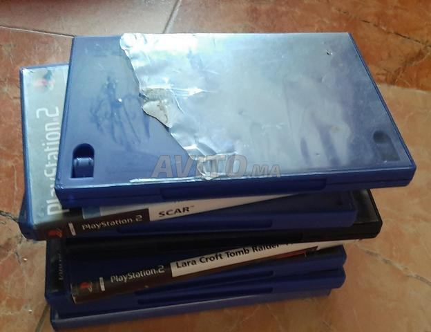 Playstation 2 en bon état avec jeux et manettes - 2