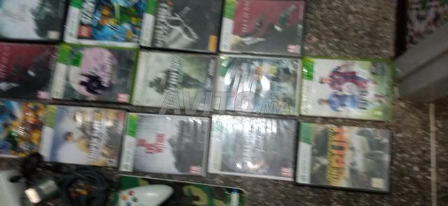 Xbox 360 مع الملحقات و 16 قرصًا - 2