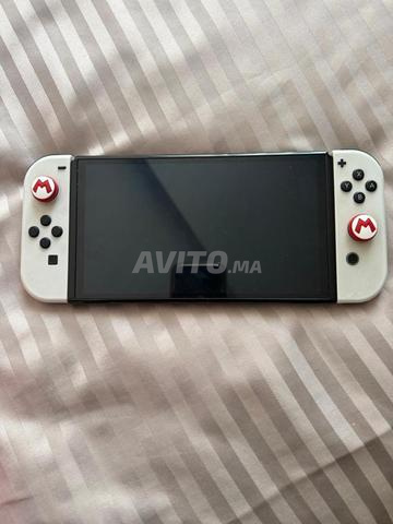 Nintendo Switch OLED + 9 ألعاب + حقيبة - 2