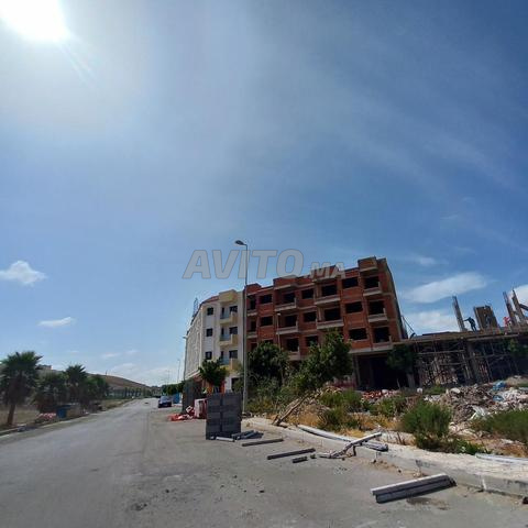 Terrain 2 façades 250 mètres, garage, lotissement 3, 3 appartements à l'étage