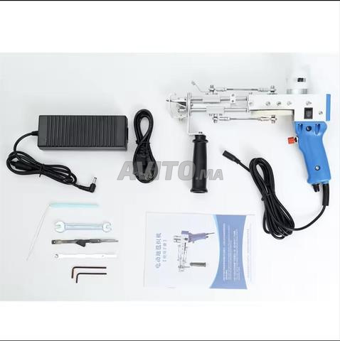 Tufting gun pour confectionner des tapis