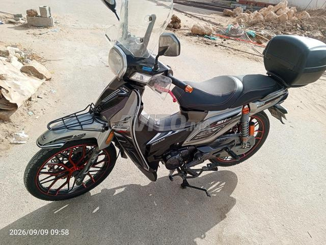n9iya 18 600. km  gris 9000 bican sh.