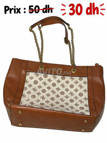 Sac à main Guess endommagé