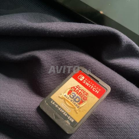 نينتندو سويتش مع لعبة وشاحنها - 2