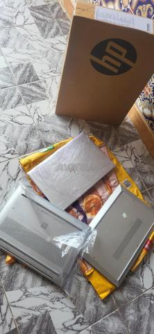 PC HP, neuf dans sa boîte, et un autre d'occasion
