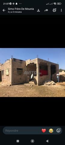 Terrain et maison en cours de construction - 2
