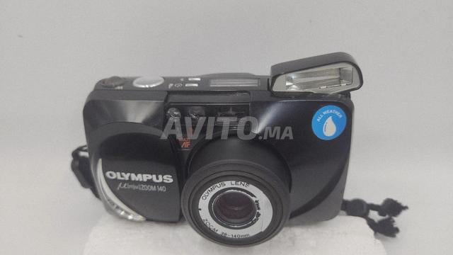 أوليمبوس MJU Zoom 140 يعمل