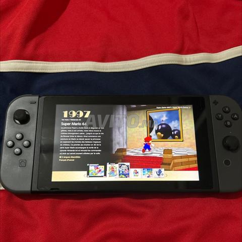 Nintendo switch avec un jeu et son chargeur - 2