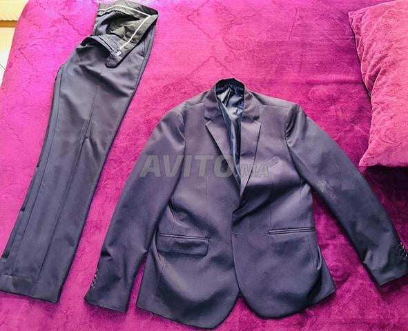 Costume bleu marine taille 44 comme neuf