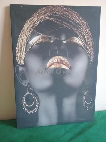 Tableau décoratif afro chic noir et doré