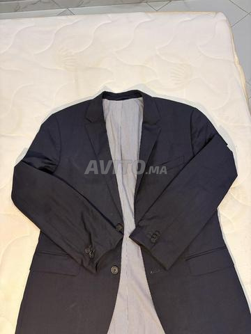 بدلات رجالية ماركات Boss و D&G