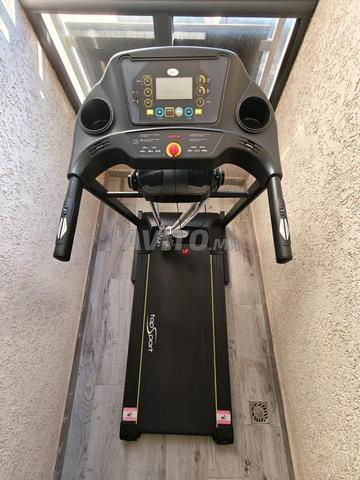 Tapis roulant avec appareil de massage