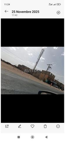أرض على الطريق الرئيسي بيوݣرة