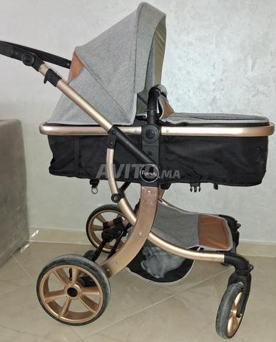 عربة أطفال مزدوجة الوجه