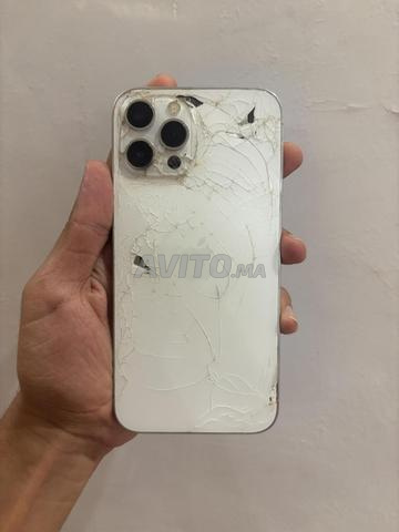 iPhone 12 Pro 256 Go, batterie 76%, composants d'origine, dos fissuré