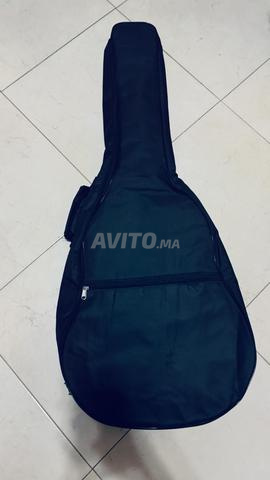 Housse de guitare avec capo