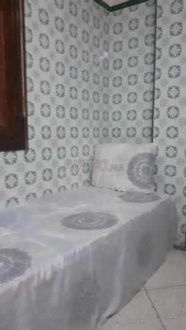 Chambre à louer avec lit simple