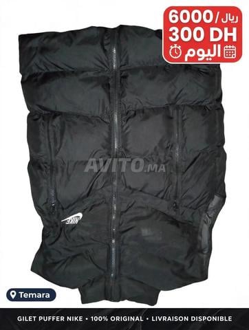 جاكيت 3 في 1 من ديكاثلون مقاس XL، مقاوم للماء وبولار